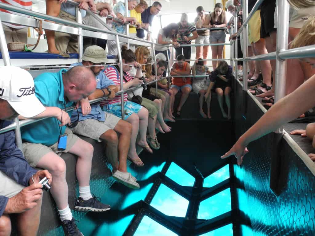Visitors view reef through glass bottom boat at Pennekamp Coral Reef State Park.