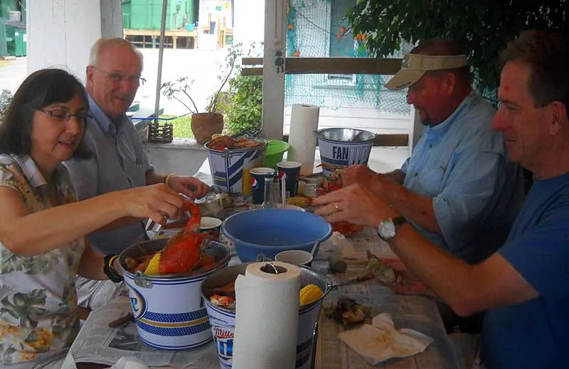 Cracking open blue crabs at Peace River Seafood in Punta Gorda