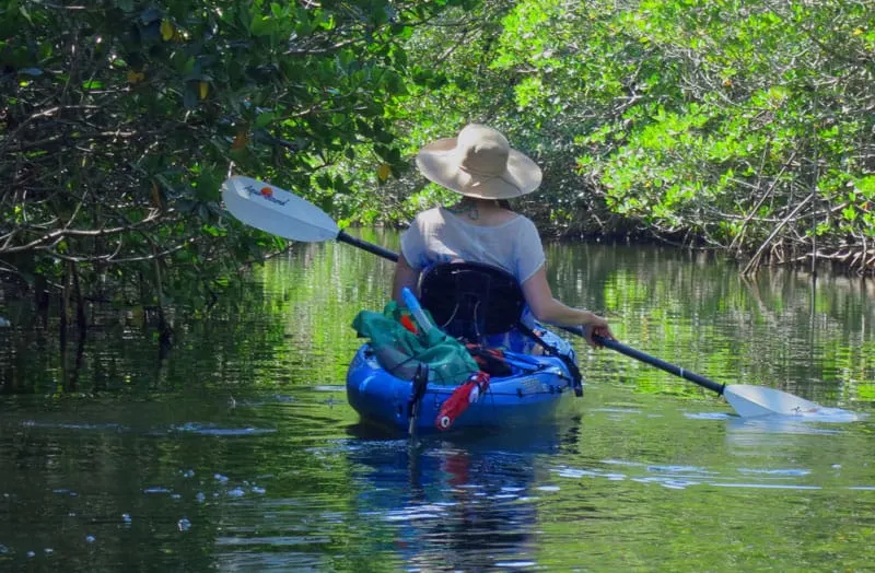 Kayaking the Florida Keys through a mangrove tunnel off Key Largo.