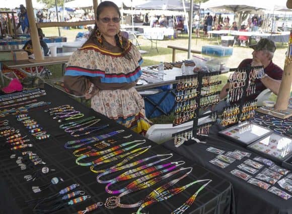 Native American vendors sells arts and traditional arts in the Indian market.