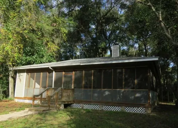 Two-bedroom cottages at Fanning Springs State Park are surrounded by forest and are close to the spring.