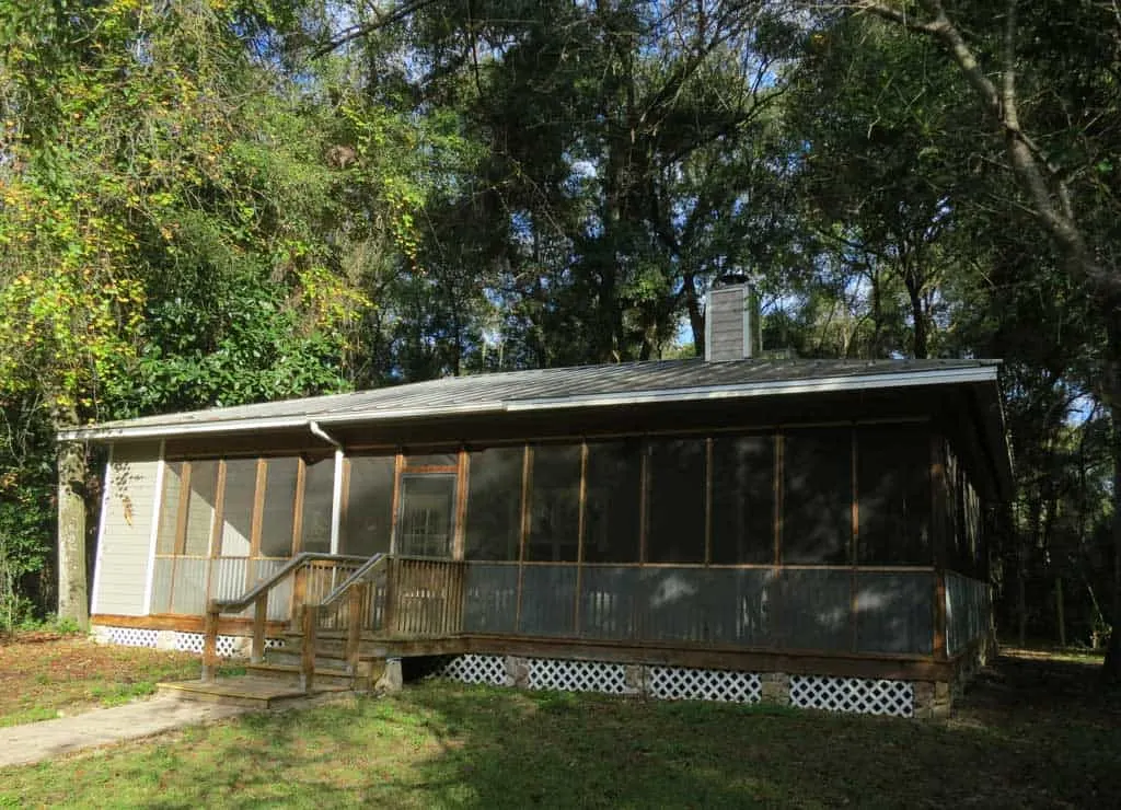 Two-bedroom cottages at Fanning Springs State Park are surrounded by forest and are close to the spring.