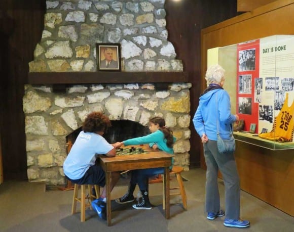Inside the Civilian Conservation Corps Museum at Highland Hammocks State Park., the field-stone fireplace has a photo of FDR on the mantle.