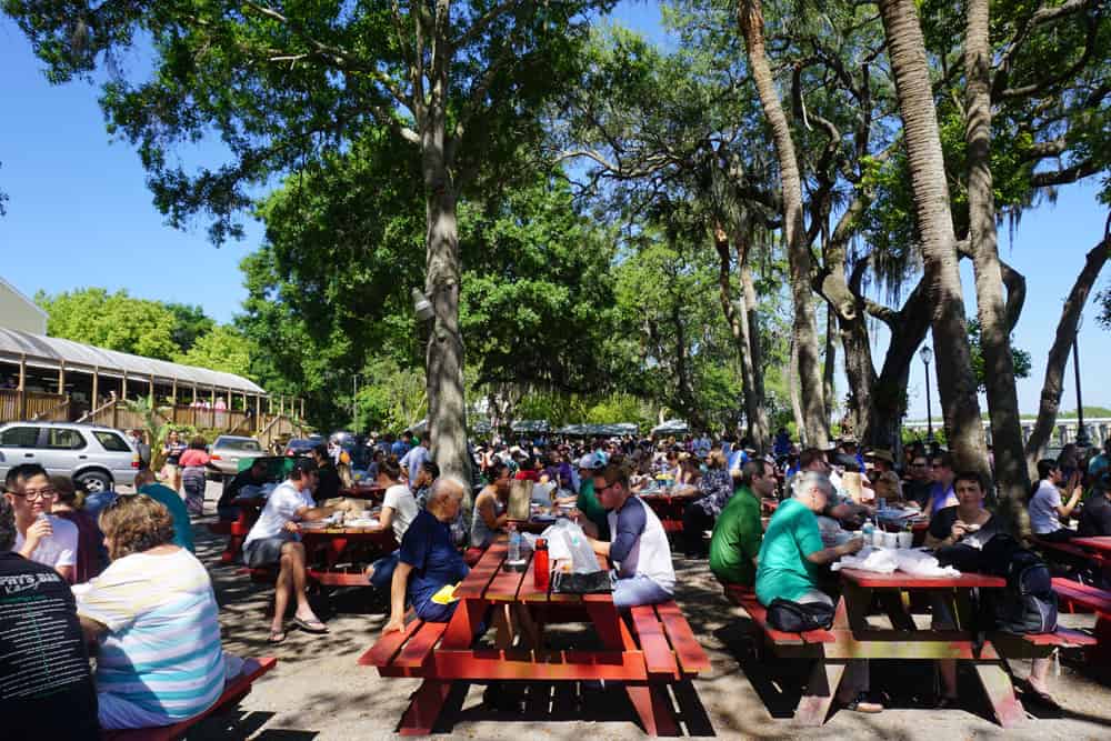 The Tampa Buddhist temple's Thai brunch is eaten at shady picnic tables overlooking the water. (Photo: Anna Blasco)