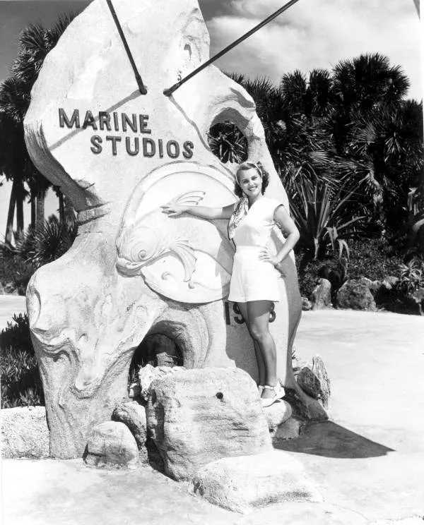 Woman standing at the entrance to Marine Studios - Marineland, Florida. 1949. Black & white photoprint, 5 x 4 in. State Archives of Florida, Florida Memory. 