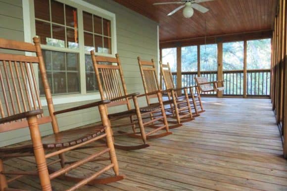 There's a row of rocking chairs on the large, wrap-around porch in the Lafayette Blue Springs State Park cabins. (Photo: Bonnie Gross)