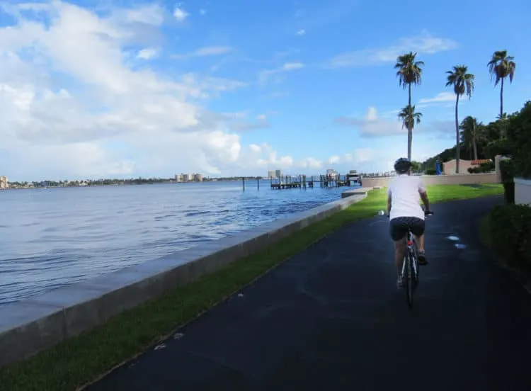 Waterfront views are a favorite feature of the Lake Trail in Palm Beach, one of the best Florida bike trails because of its mix of unusual scenery. 