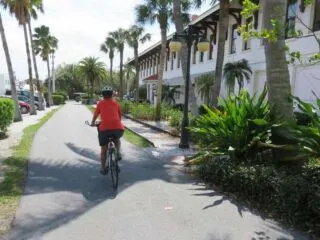 The train station in Boca Grande has been converted into a complex of shops and the popular Loose Caboose cafe. The bike path runs alongside. You can see tracks adjacent to the trail on the right. (Photo: David Blasco)