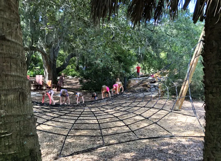 A spider web in the Bok Tower Gardens, Lake Wales, gets kids involved. (Photo: Deborah Hartz-Seeley)