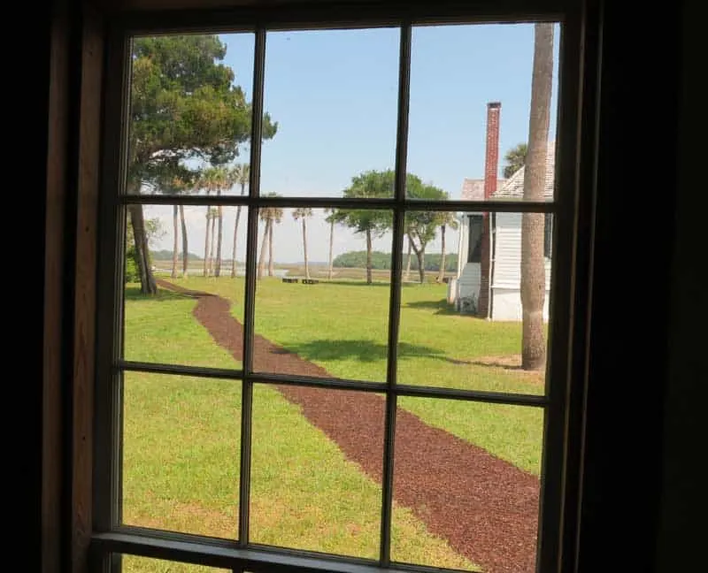 The view from the kitchen, which was a separate building, looking toward the main house and waterfront.