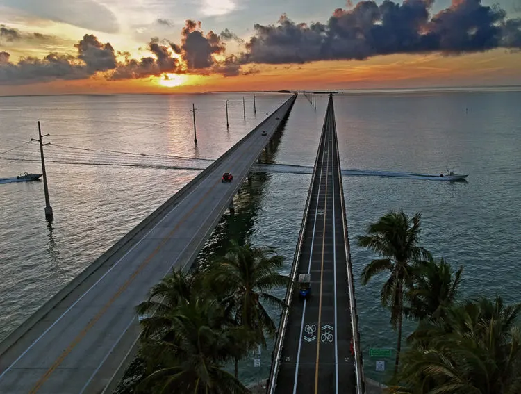 The New Seven Mile Bridge, at left, and the historic Old Seven Mile Bridge, at right, at sunset. (Photo: Andy Newman, Keys News Bureau)