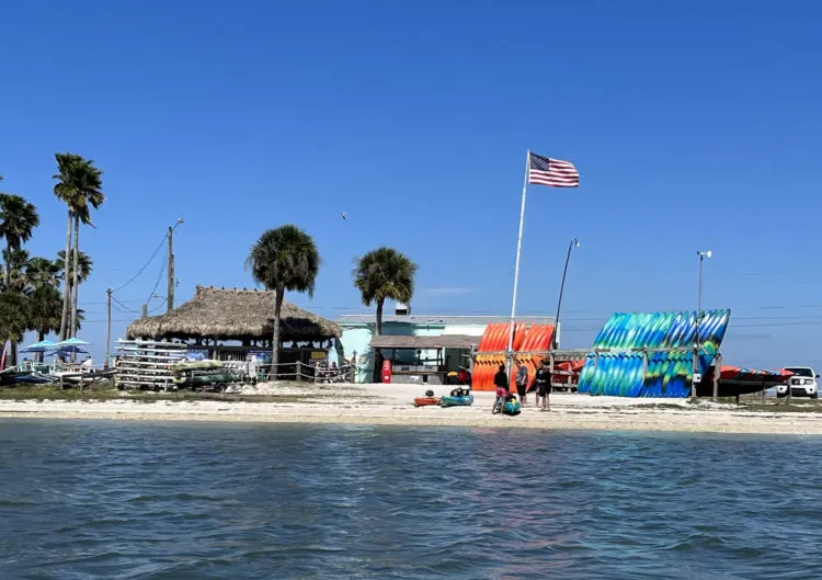 Caladesi Island State Park: Look for the tiki hut and bright kayaks and SUPs at Sail Honeymoon on the causeway tp Honeymoon Island. (Photo: Bonnie Gross)