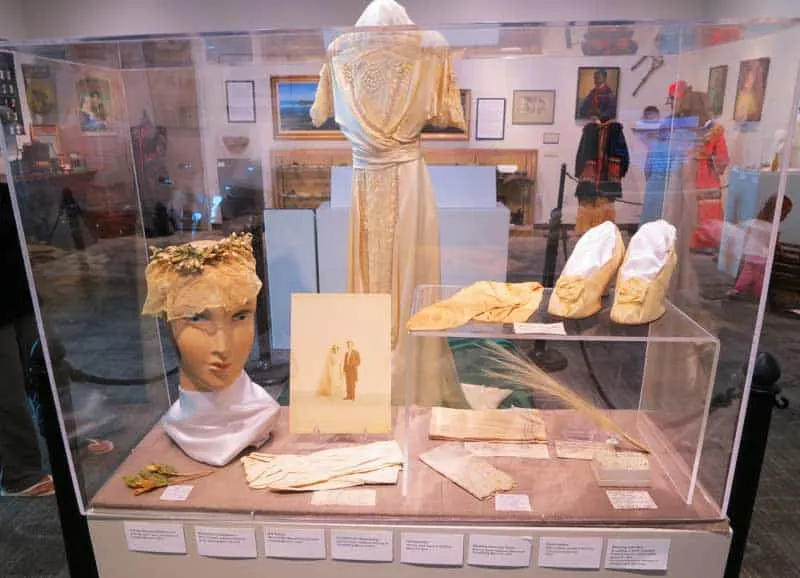 The wedding dress was worn by five members of the same local family. The wedding photos are displayed, too, at the Elliott Museum. Stuart, Florida.