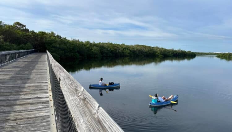 John D. MacArthur Beach Park: Perfect blend of kayaking, snorkeling, beach 2 Kayakers relaxing at John D. MacArthur Beach State Park on the saltwater lagoon the separates the entrance and picnic area from the beach. (Photo: Bonnie Gross)