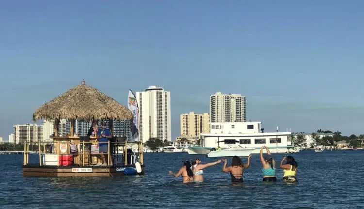Peanut Island is a popular destination for partying boats. This floating tiki bar brought a sunset celebration to the shoreline. (Photo: Bonnie Gross)