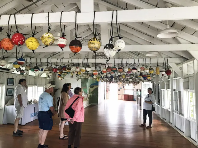The historic building that housed workers on the Seven Mile Bridge from 1908 to 1912 is now an education center where school children from around the country come to learn about the unique environment in the Florida Keys. Here a tour group hears the island's history. (Photo: Bonnie Gross)