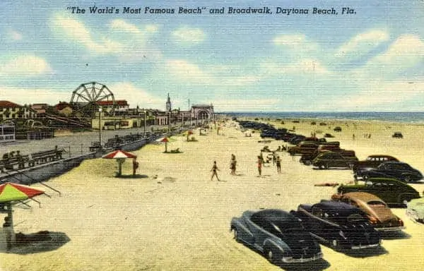 Driving on the beach in a vintage postcard.