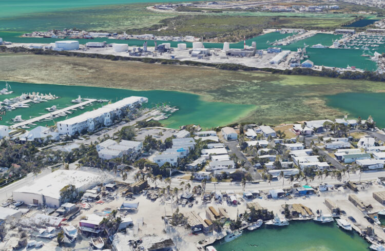 This aerial view of Stock Island shows how mobile homes (in the foreground) share the island with industry as well as marinas for yachts and pleasure boats.