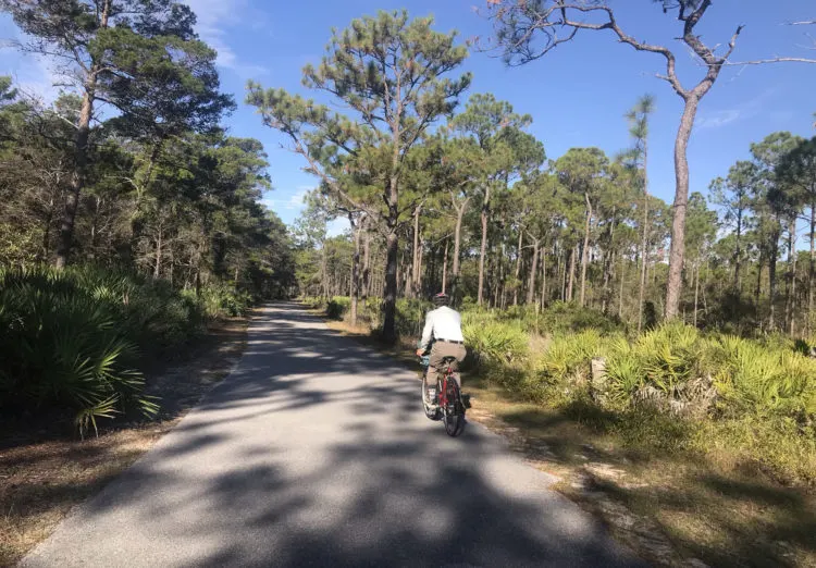 A car-free paved road leads to the hiking trailhead at Topsail Hill Preserve State Park. (Photo: Bonnie Gross 